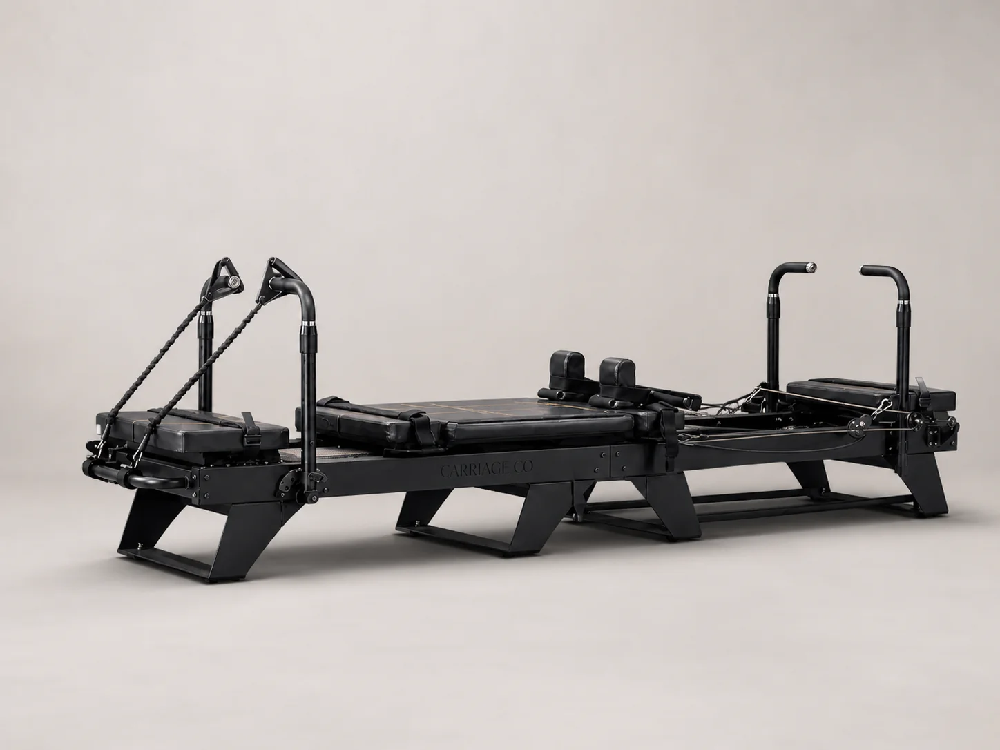 Carriage One commercial reformer in a wide black three-quarter product view