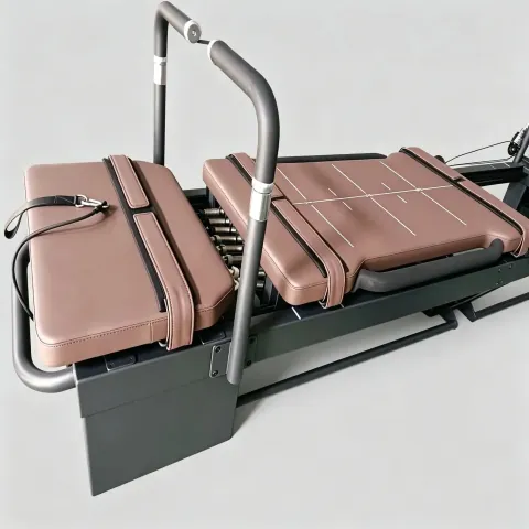 Brown-upholstered Carriage One commercial reformer on a light studio floor