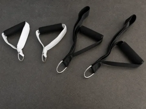 Four Carriage One handle and strap assemblies with foam grips and metal rings